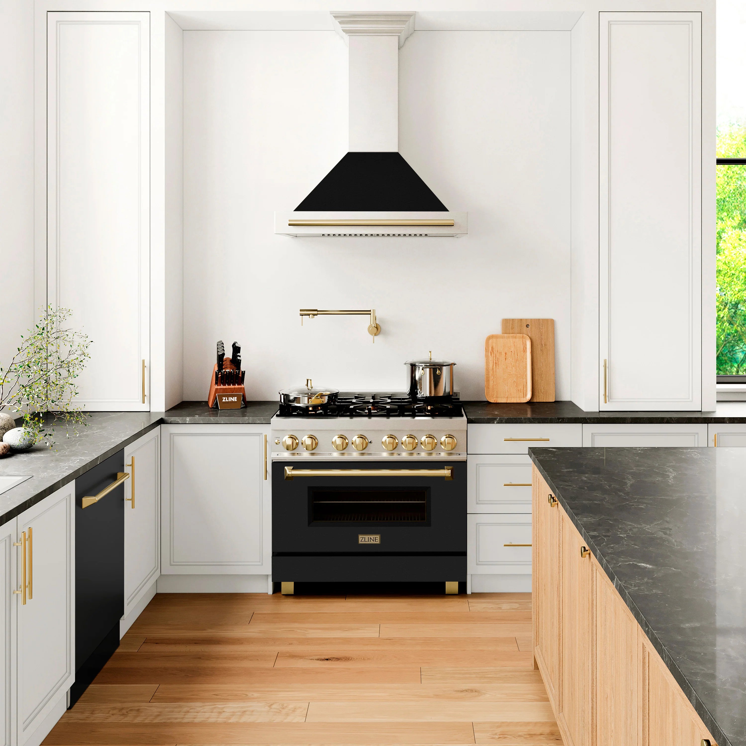 Dual fuel range in a kitchen with gold trim, black oven door, and gas burners