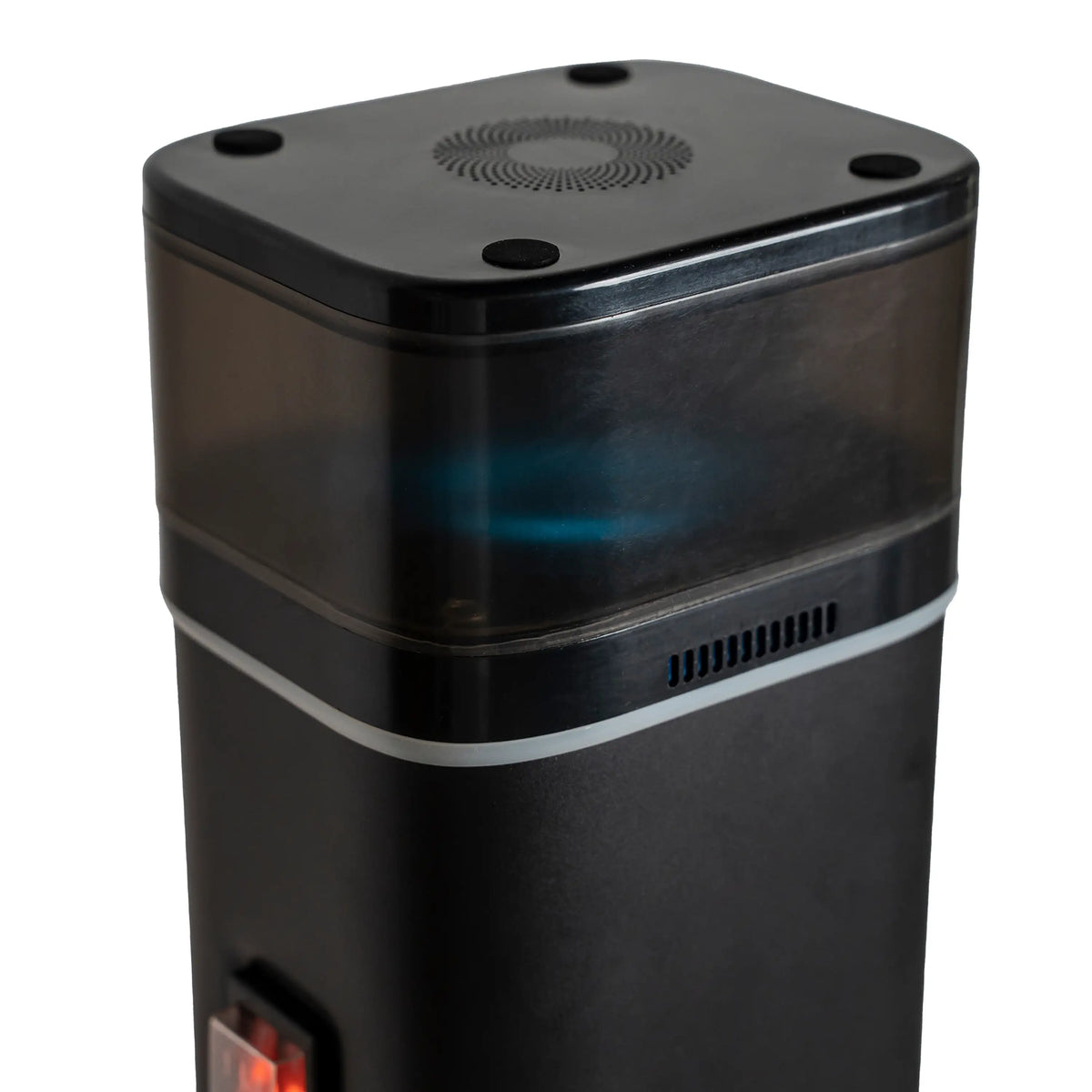 Black top of electric heater column with vented speaker grille