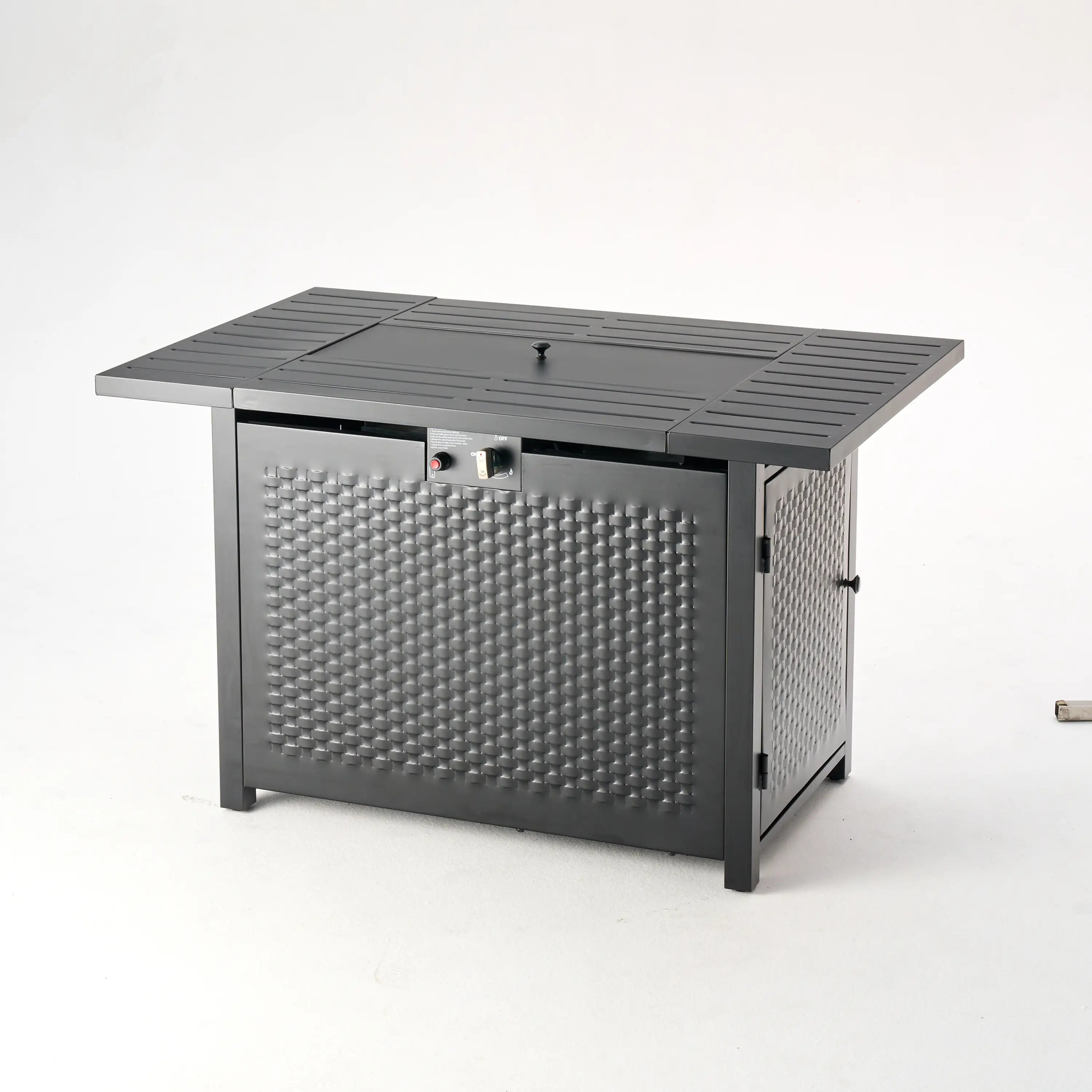 Dark outdoor fire pit table with textured front panel and side control