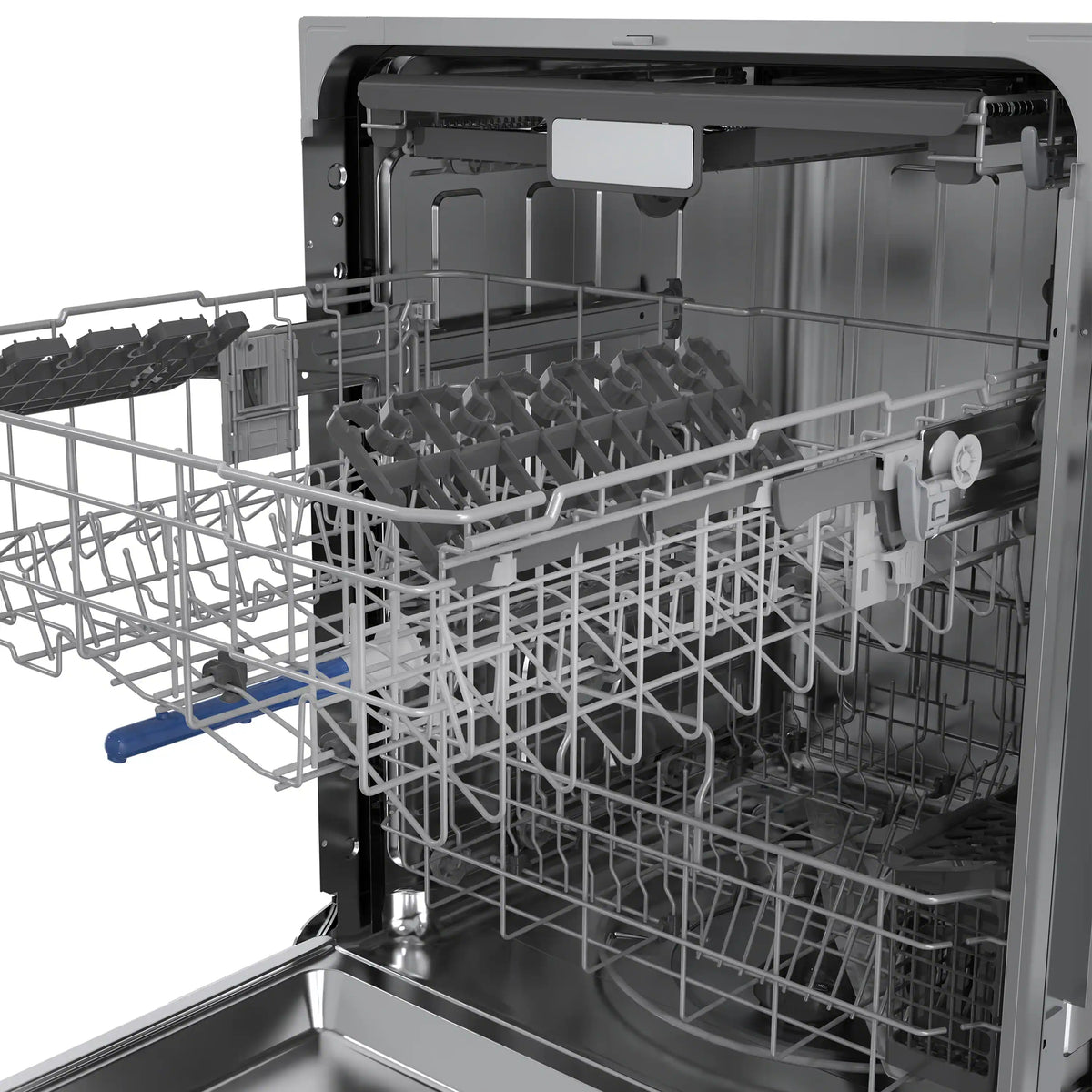 Dishwasher interior with multiple racks and foldable plate supports, open door
