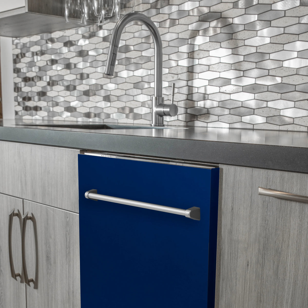 Blue-gloss dishwasher door with stainless handle in a built-in kitchen setup