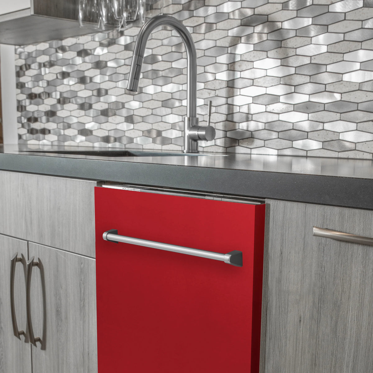 Red matte built-in dishwasher with long traditional handle and stainless faucet nearby