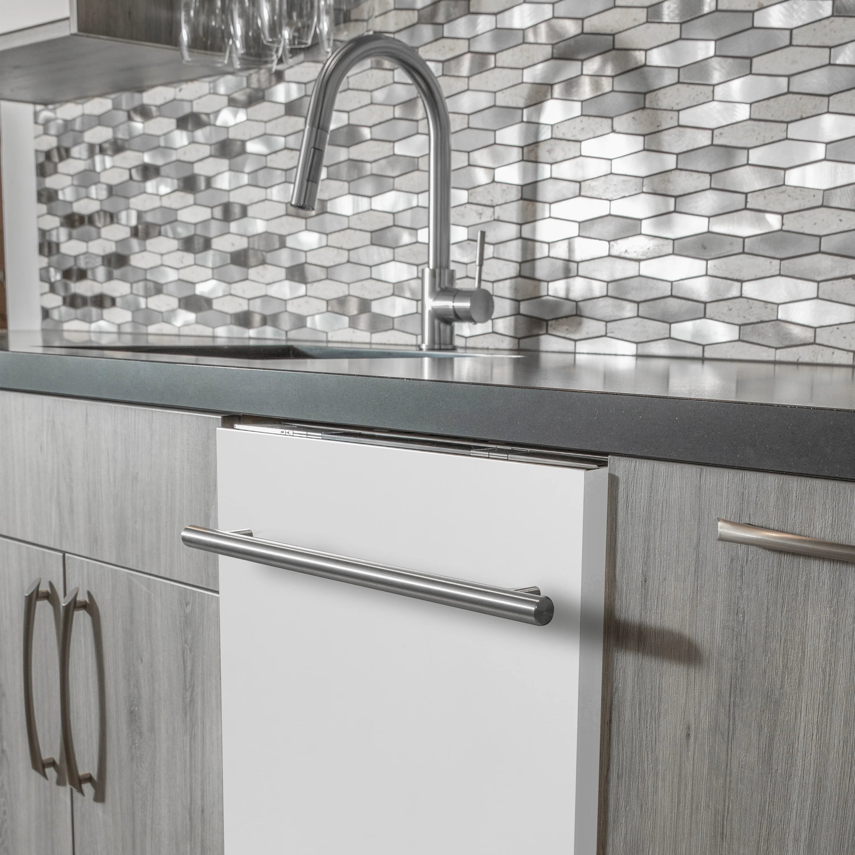 Built-in dishwasher door with stainless handle above dish rack area