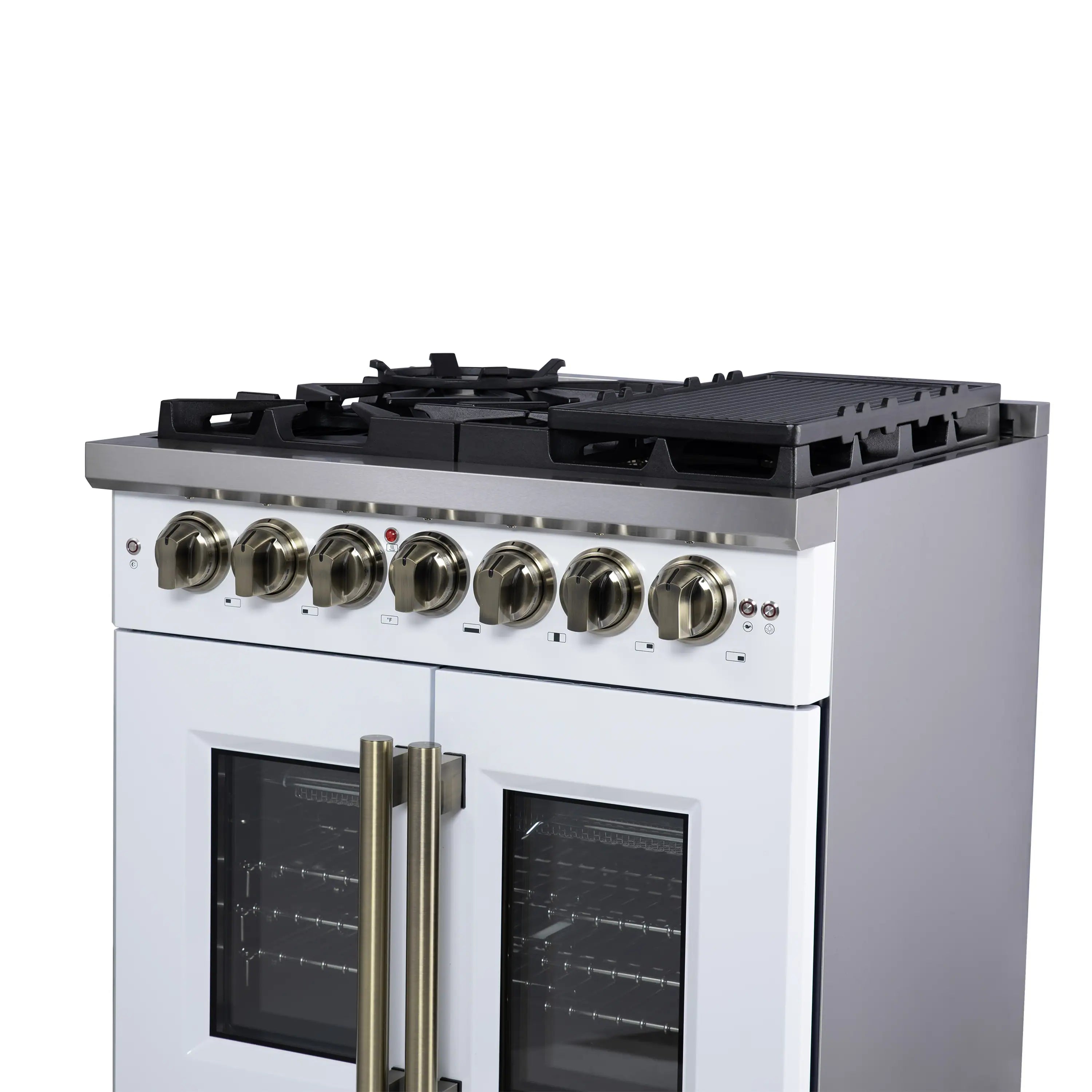 White dual fuel range with black cooktop grates and brass control knob handles.