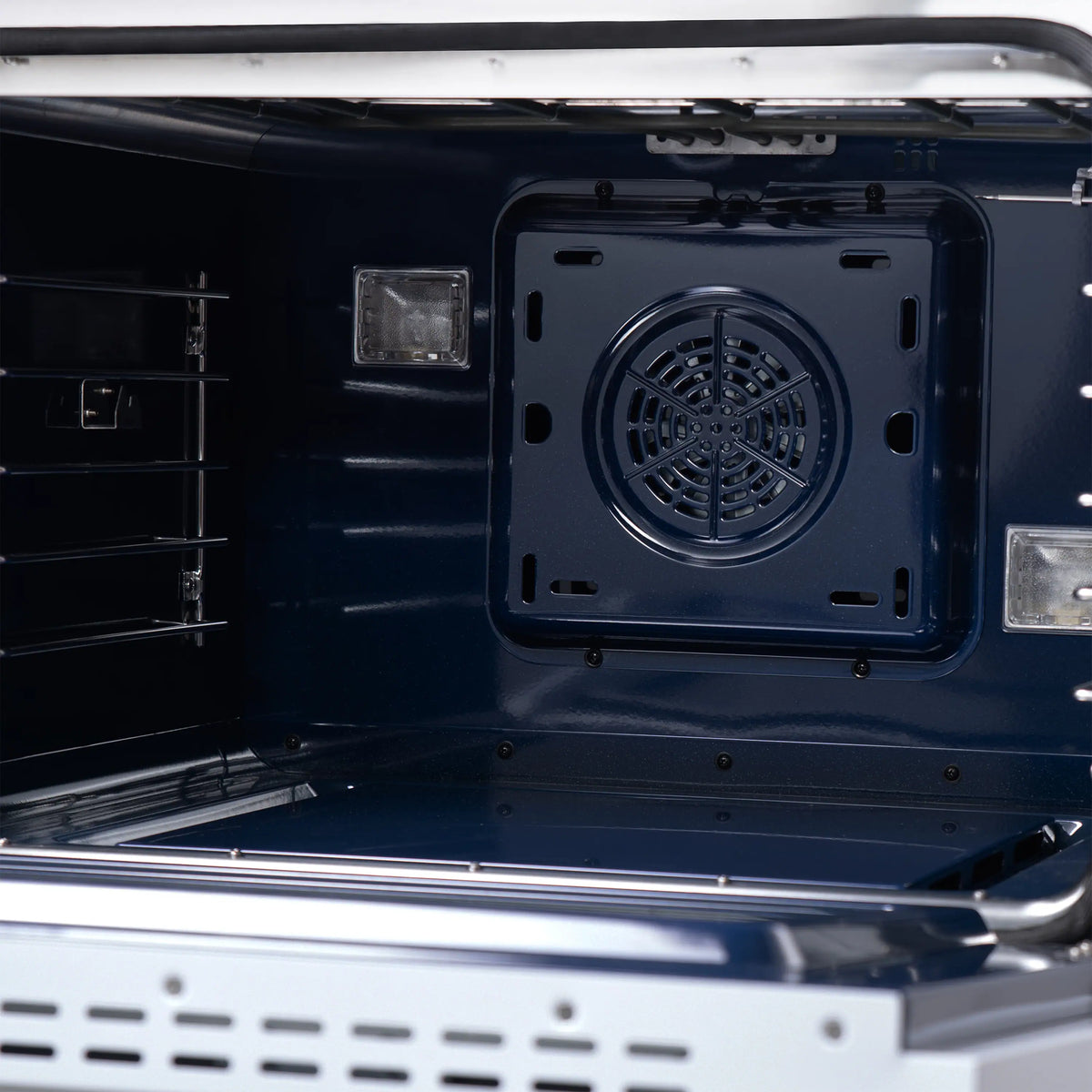 Gas range oven cavity with rear fan and circular vent plate