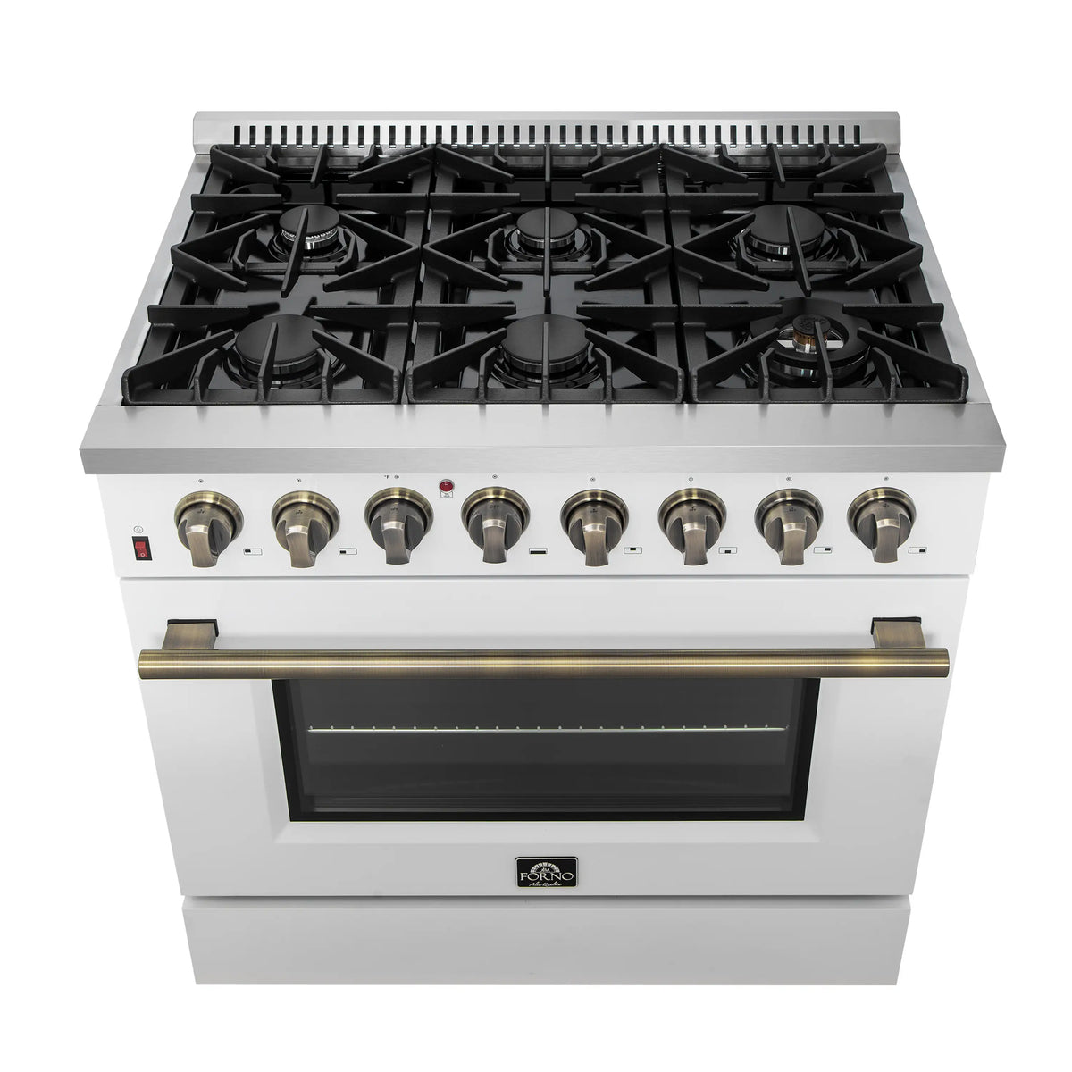 White dual fuel range cooktop with black grates and brass control knobs, oven door closed