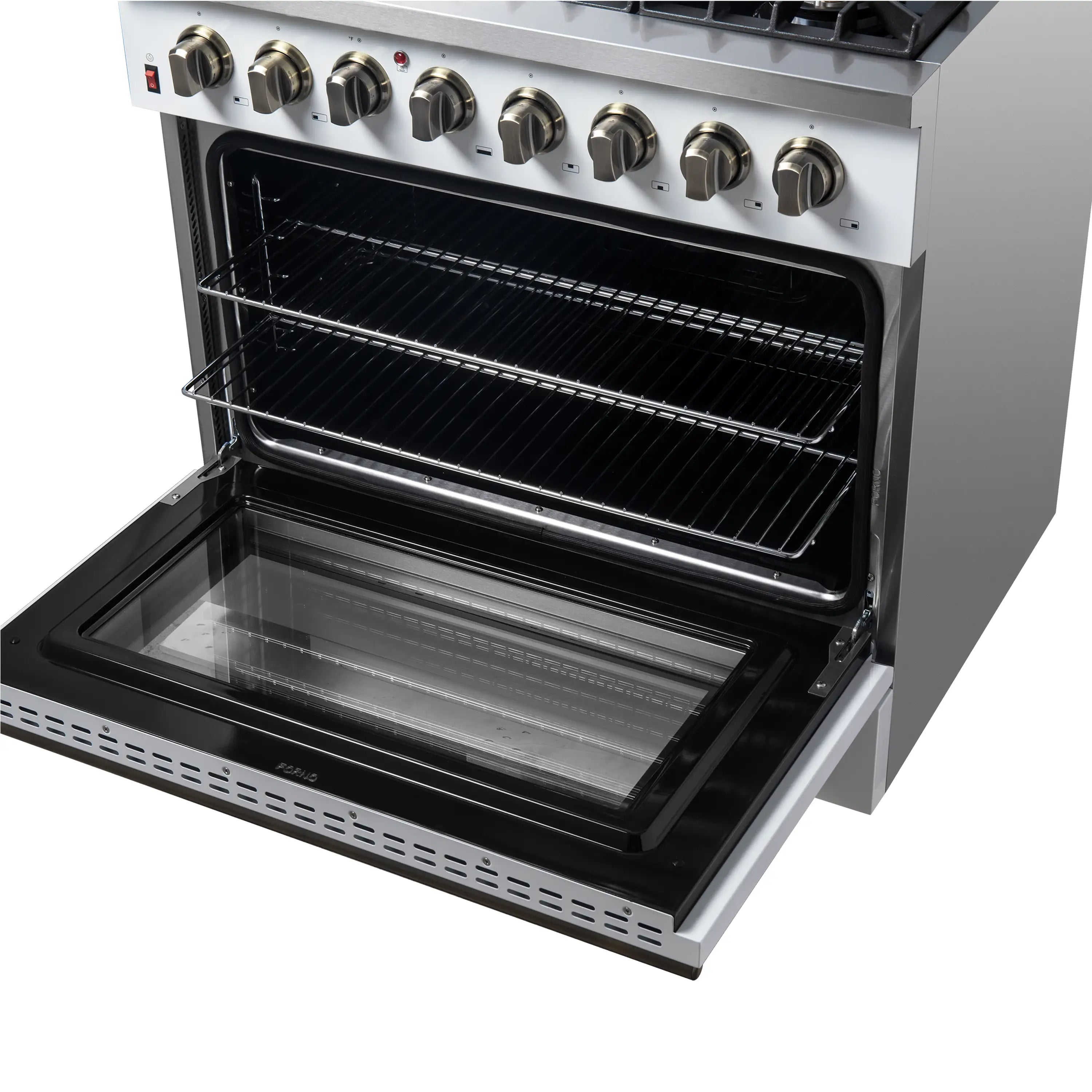 Open oven drawer with black glass interior and brass control knobs above