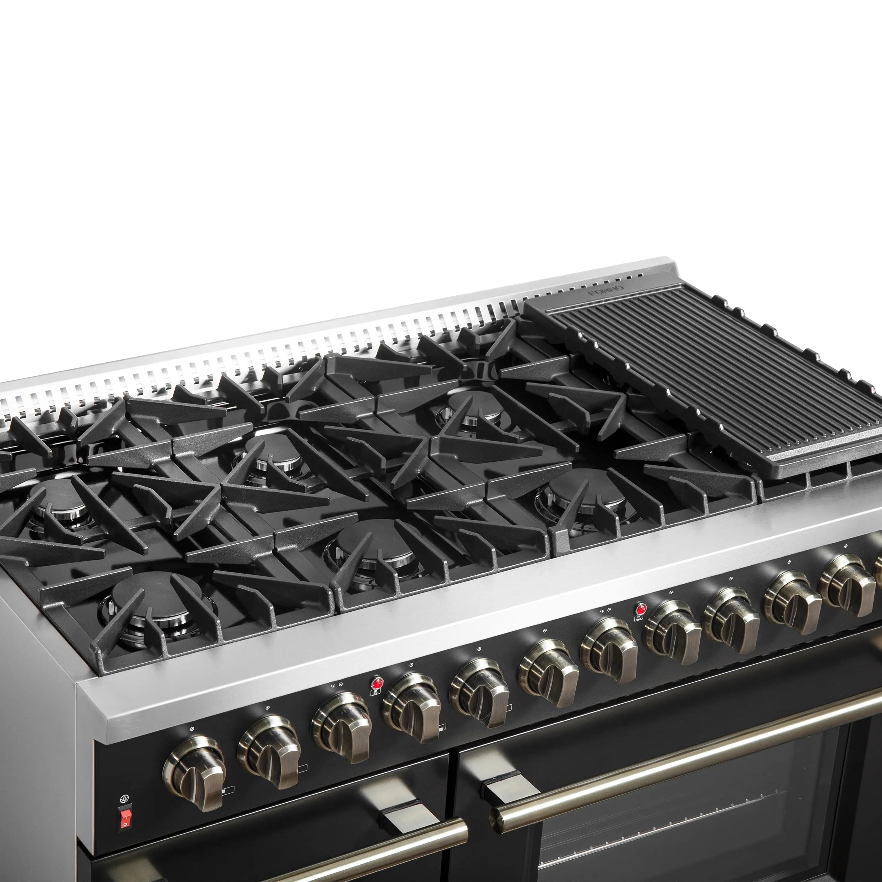 Black dual fuel range cooktop close-up with grates, brass knobs, and griddle on right