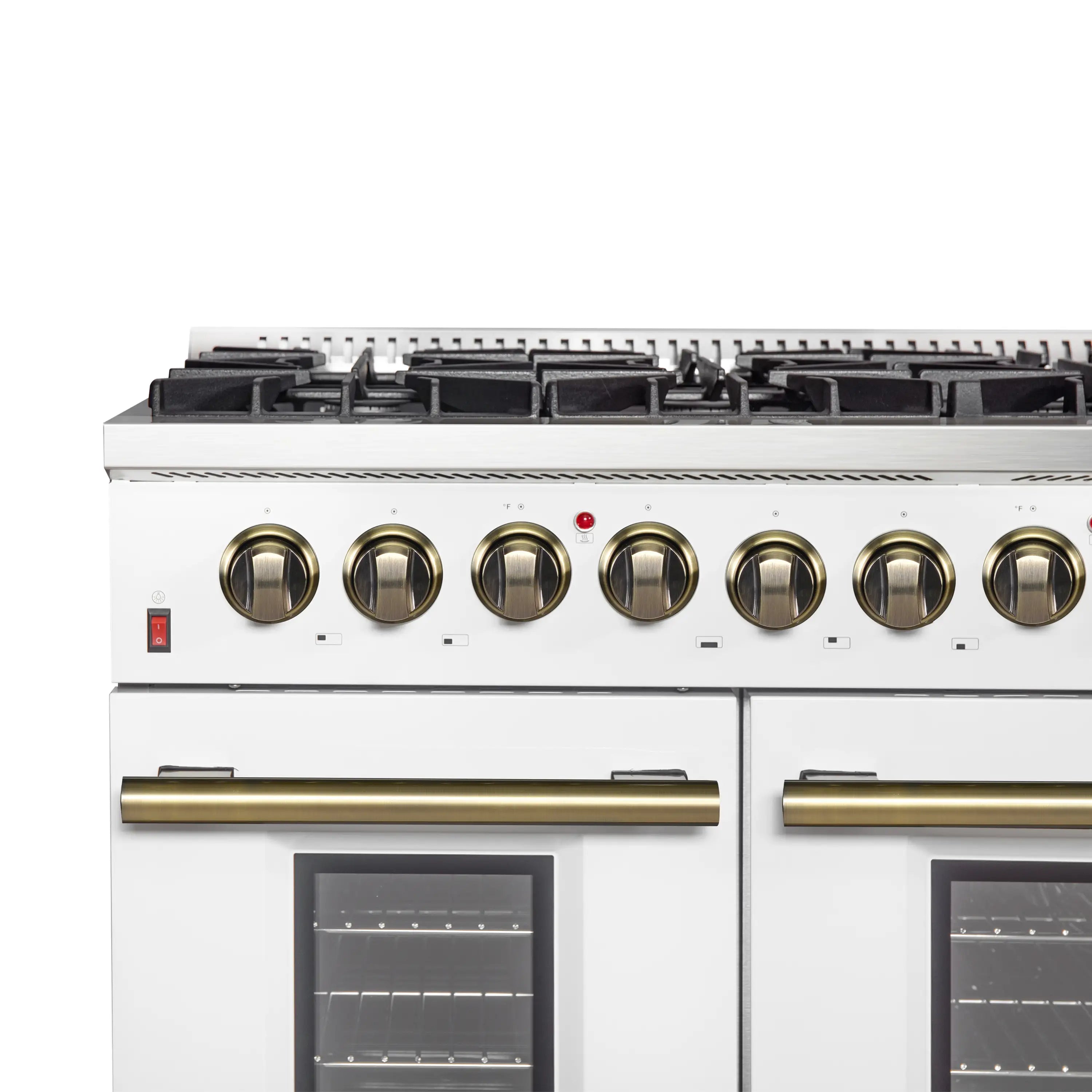 White dual fuel range control panel with antique brass knobs and front oven doors