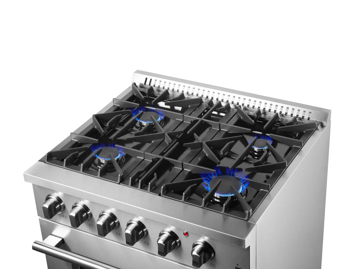 Stainless steel dual fuel range top with four black gas burners and blue flames