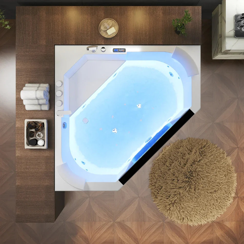 White alcove massage whirlpool tub with blue LED glow and built-in left-side control panel