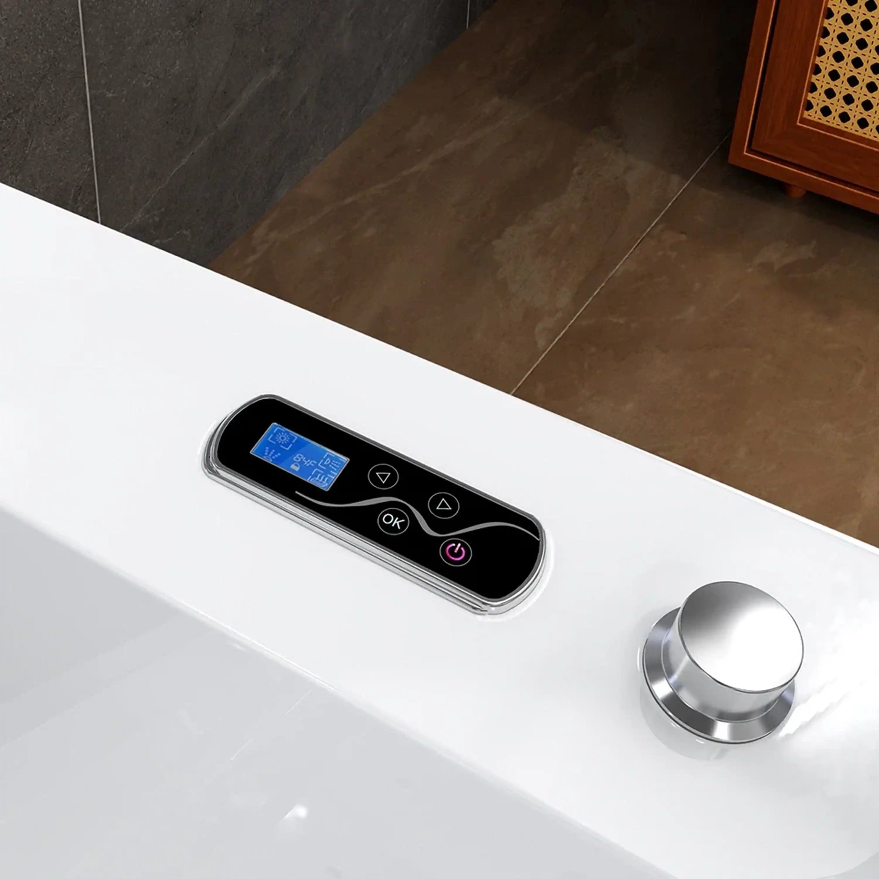 White whirlpool bathtub control panel with digital display and chrome knob