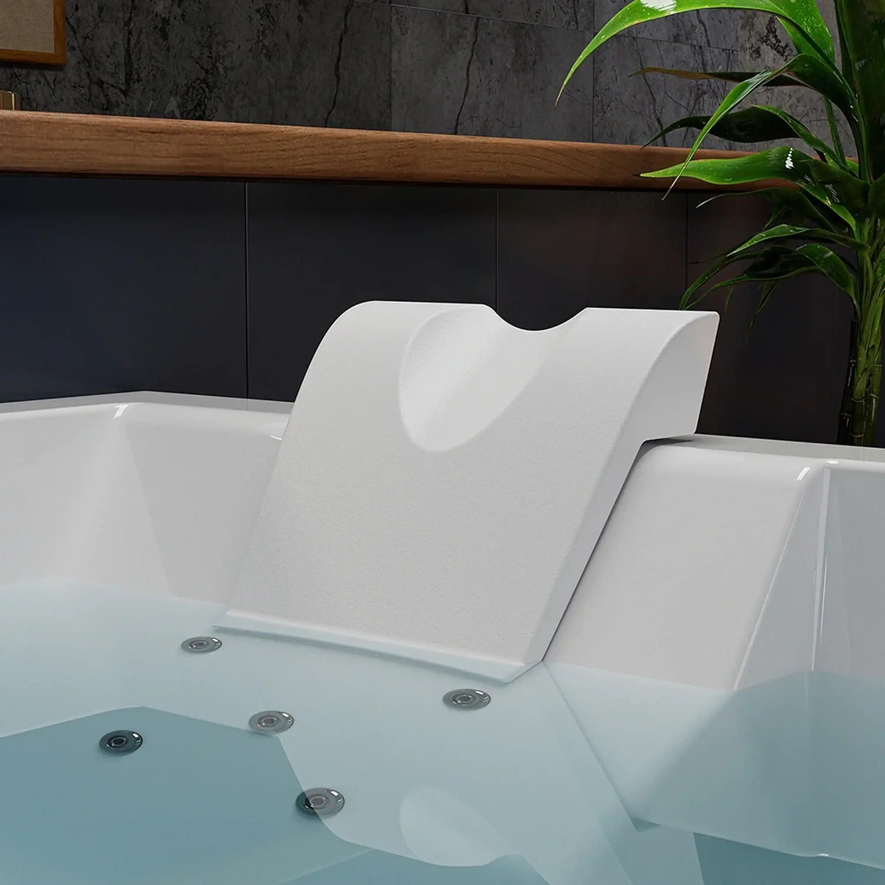 White whirlpool tub with built-in backrest and recessed massage jets