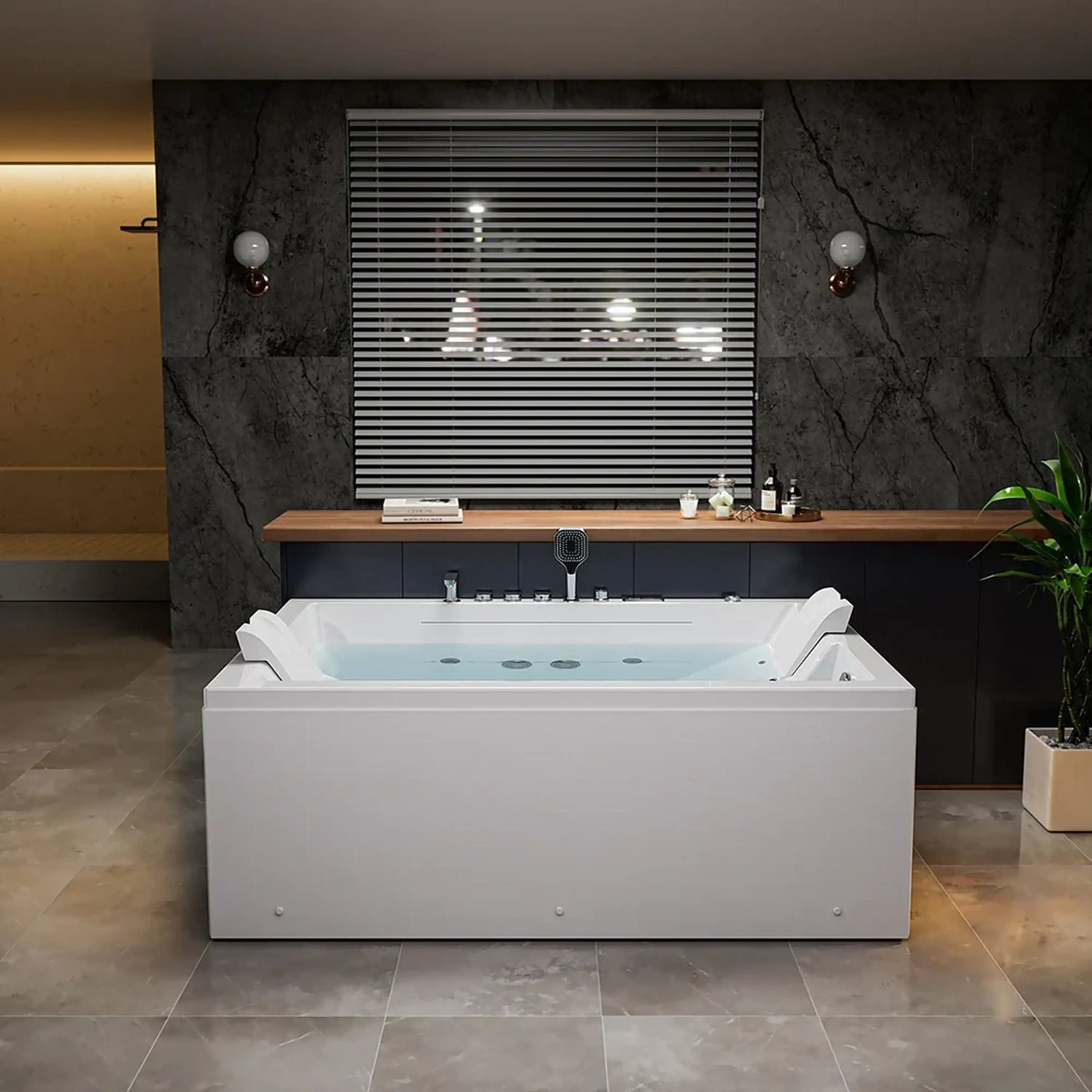 White alcove whirlpool bathtub with shower fixtures and multiple massage jets