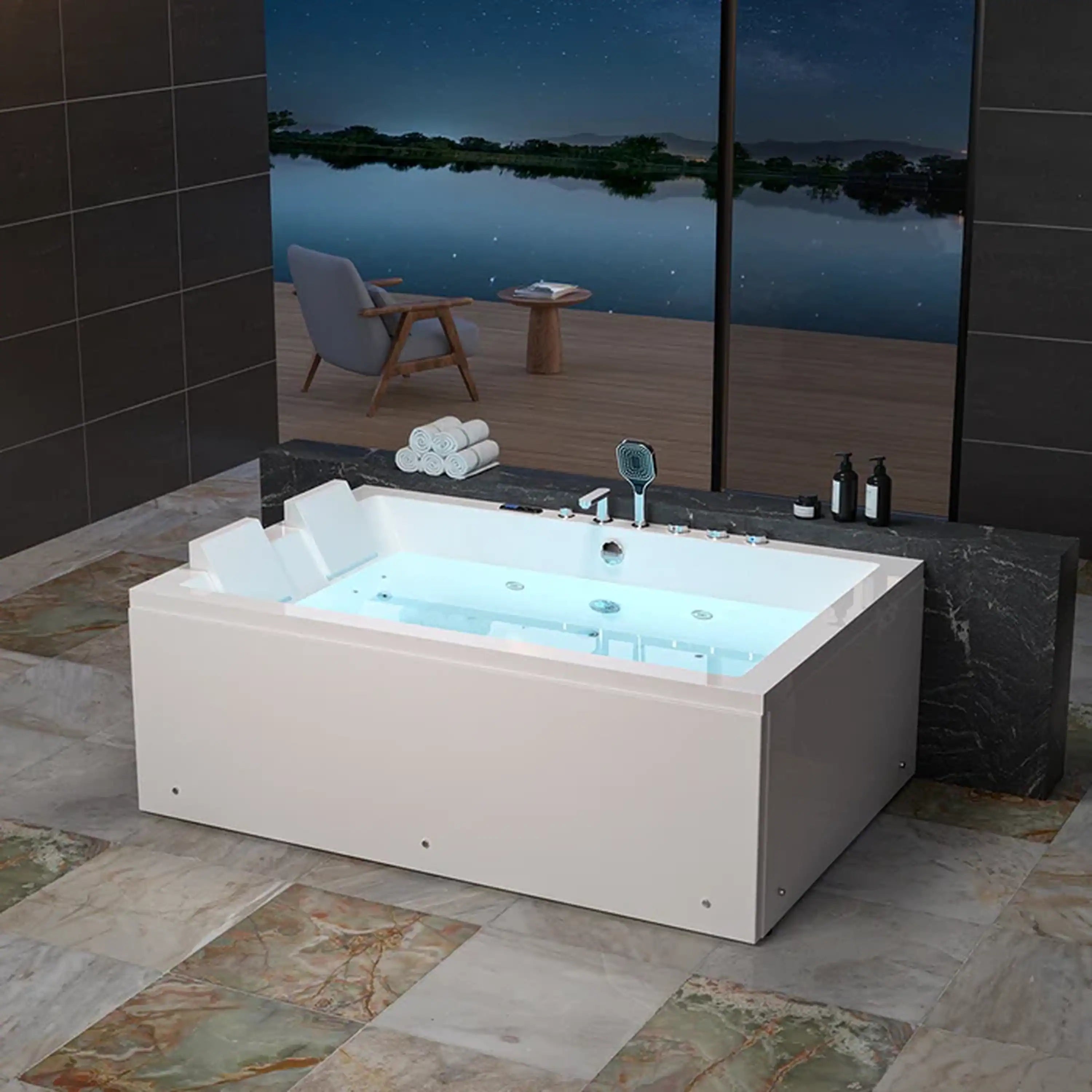 White alcove dual-massage whirlpool bathtub with center drain, angled view