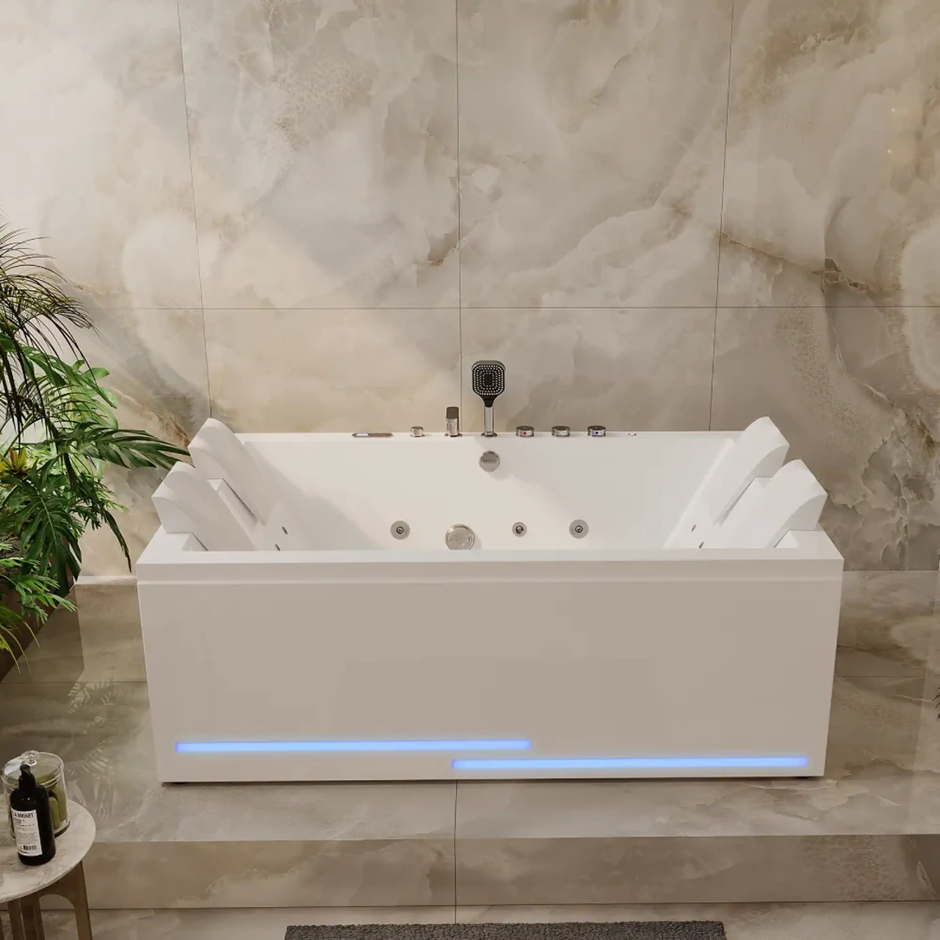 White alcove whirlpool bathtub with blue-lit strip and multiple jet openings on tub deck