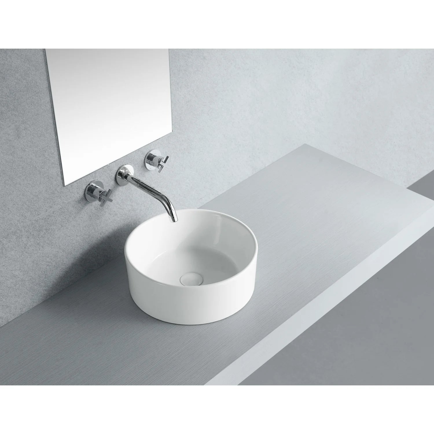 White round ceramic vessel sink with chrome faucet mounted beside