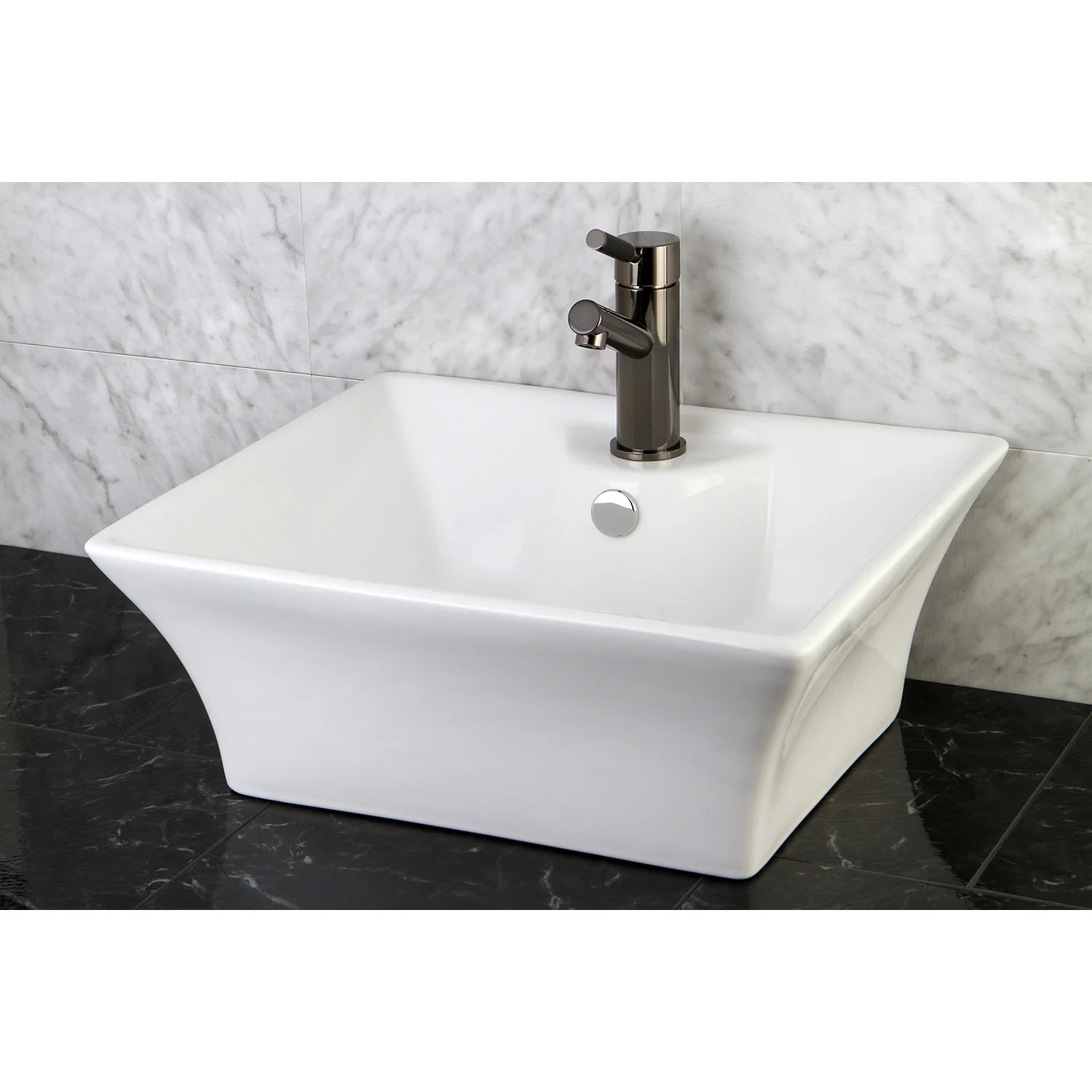 White ceramic rectangular vessel sink with black single-hole faucet