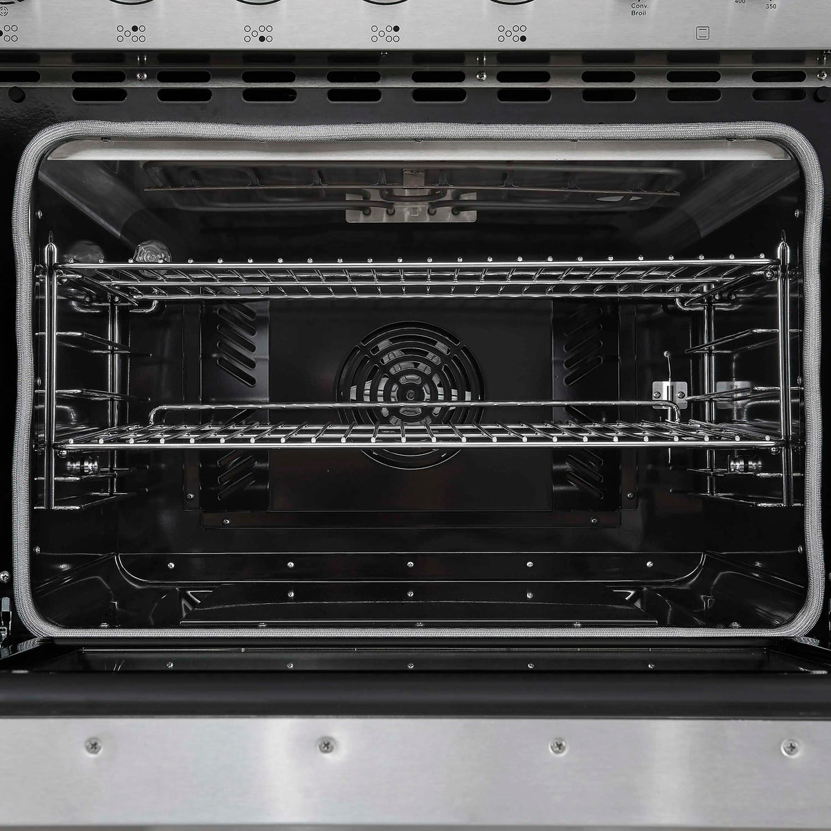Upper oven interior with racks and rear fan housing in stainless electric range