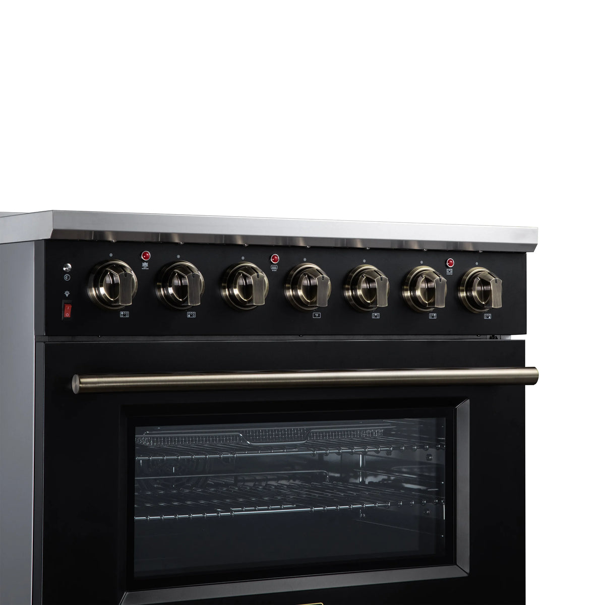 Close-up of black burner control knobs and glass oven window on freestanding range