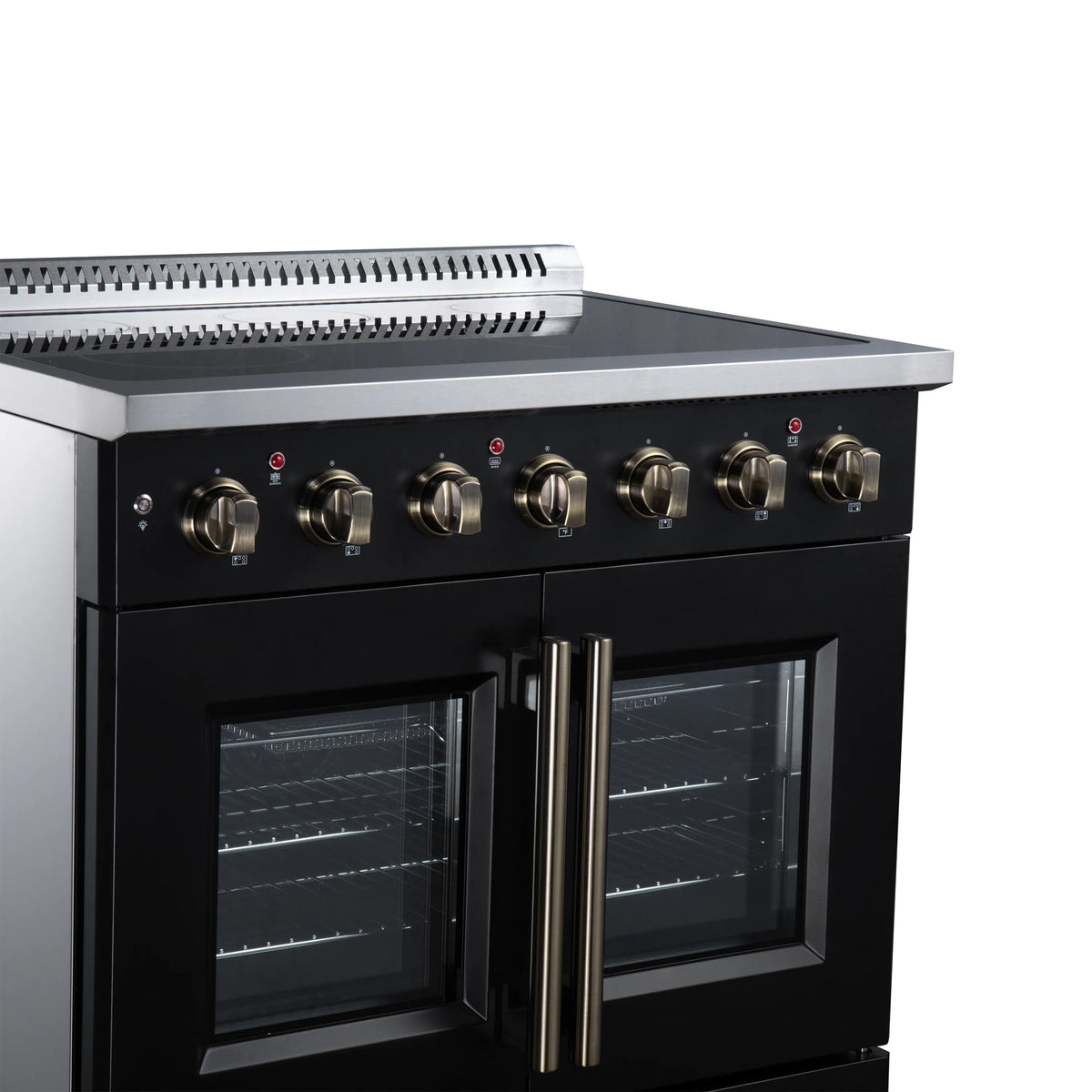 Black electric range control panel with gold knobs above French-door oven doors