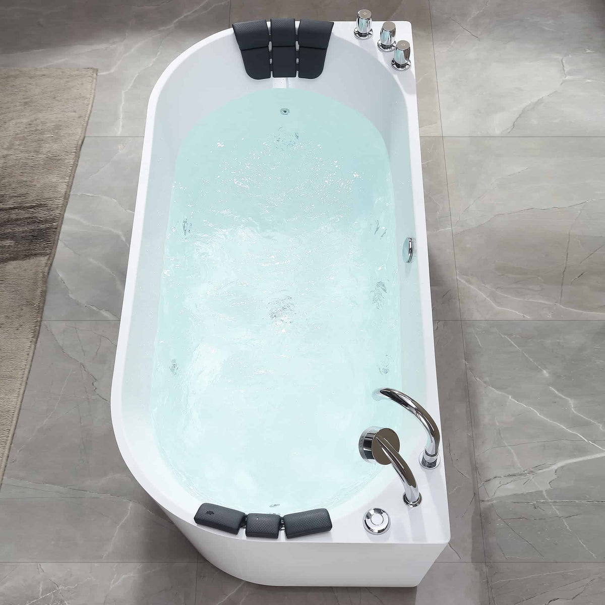 White acrylic whirlpool bathtub with mint-blue water, chrome hand shower, and headrests