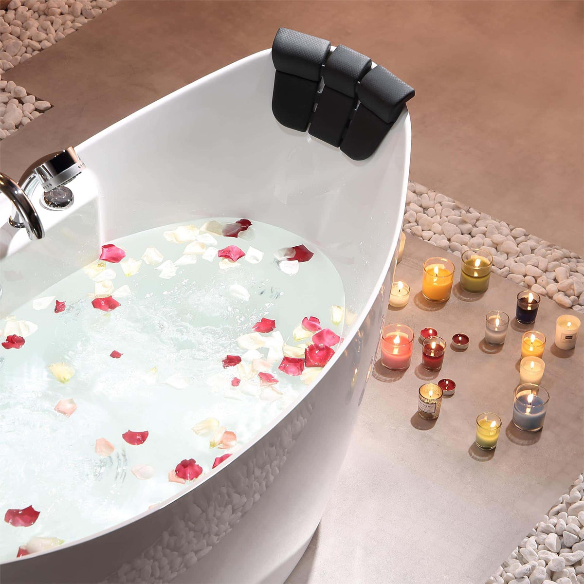 White freestanding acrylic whirlpool bathtub with black headrests and rose-petal water surface