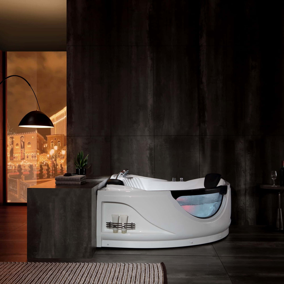 White corner whirlpool bathtub with chrome faucet fixtures and soft blue LED glow