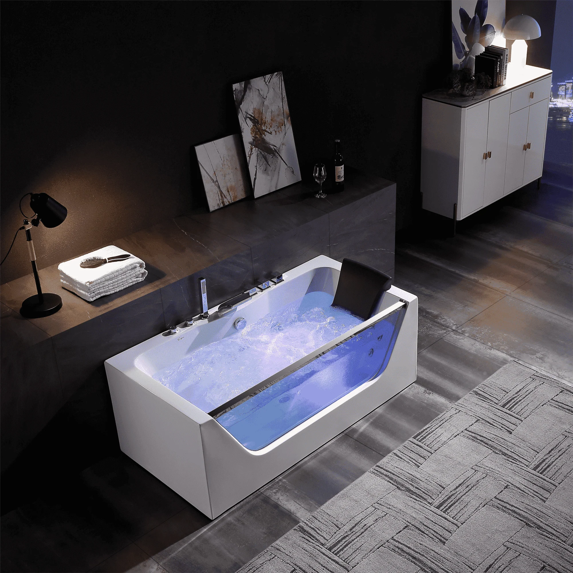 Rectangular whirlpool bathtub with black headrest and blue LED water illumination