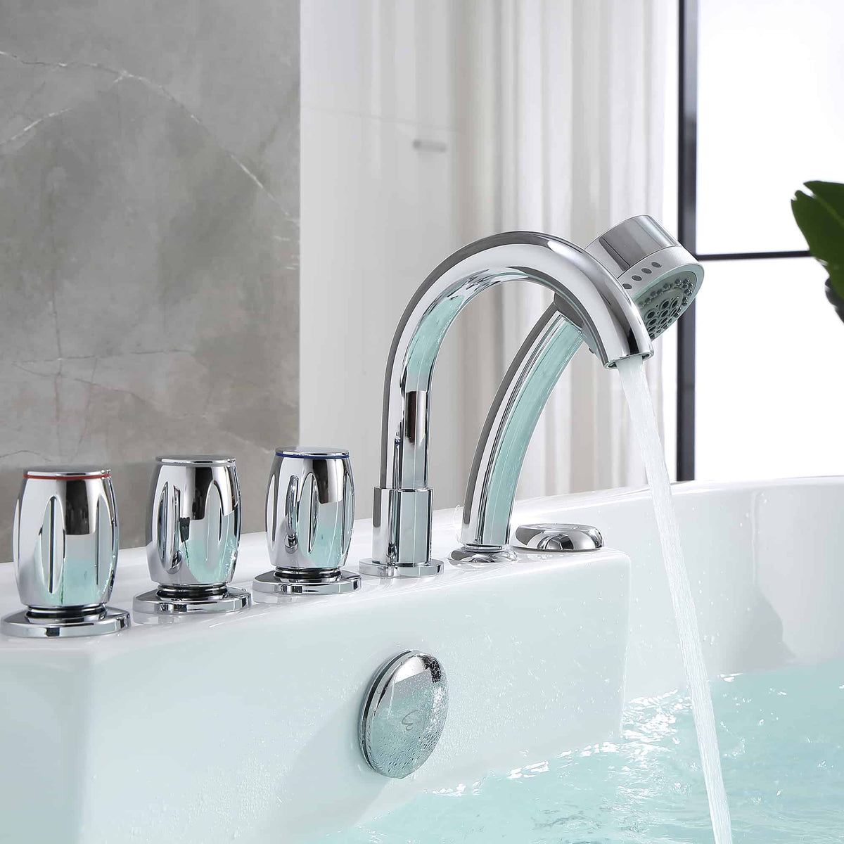 Chrome faucet fixtures on white whirlpool bathtub ledge with blue water fill.