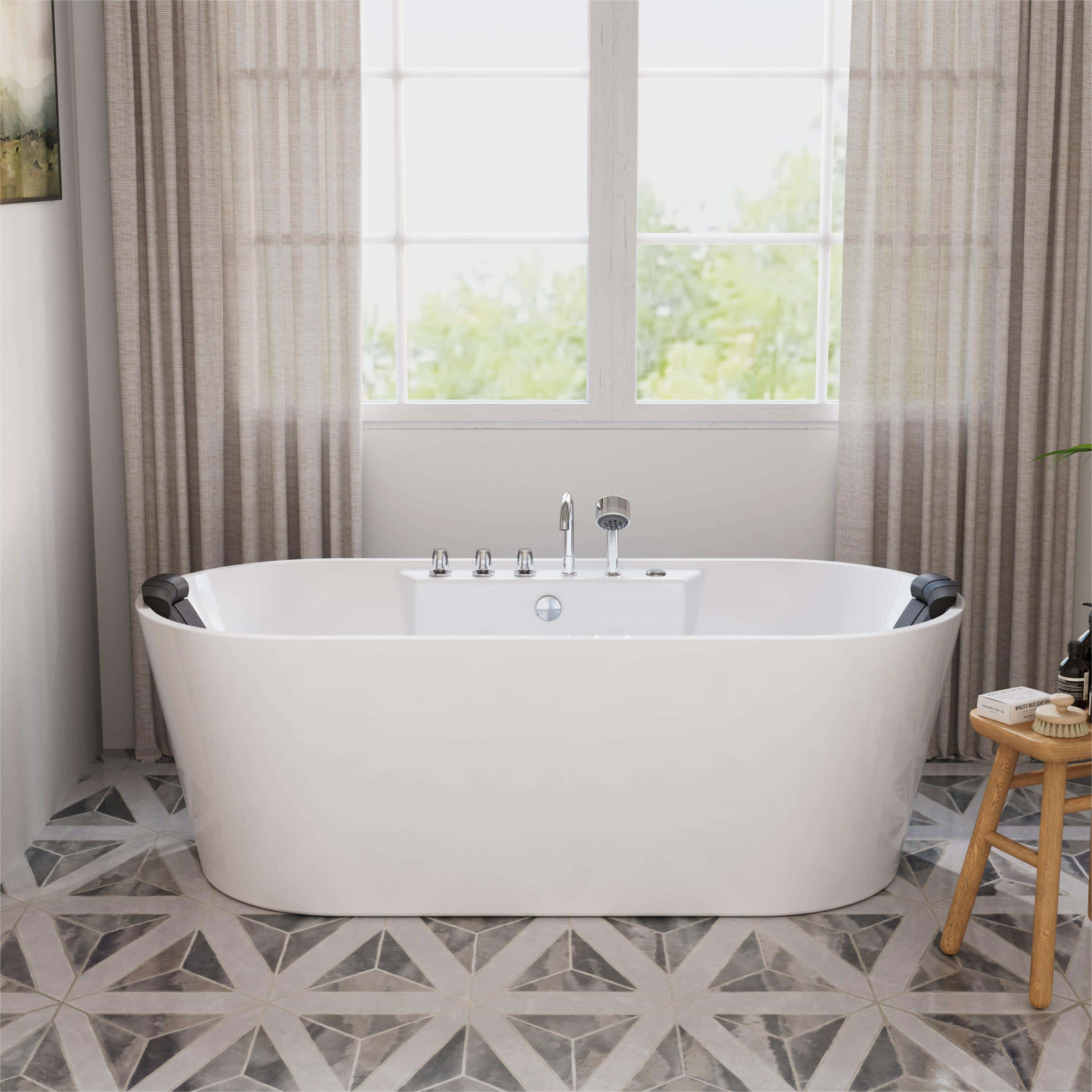 White freestanding acrylic whirlpool bathtub with chrome faucet and side control panel.
