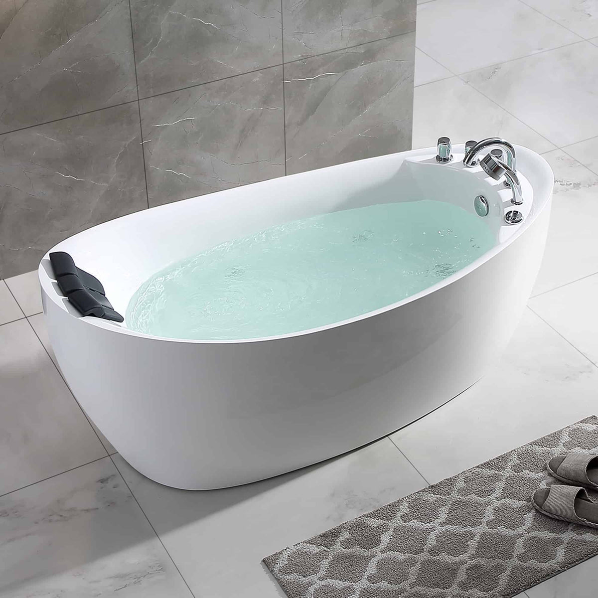 Side view of white acrylic whirlpool bathtub with chrome faucet and light-blue water