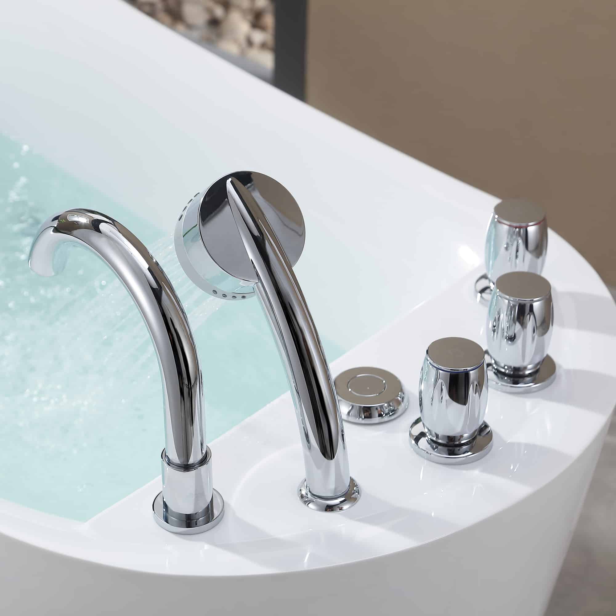Chrome faucet and handles with circular controls on a white acrylic bathtub.
