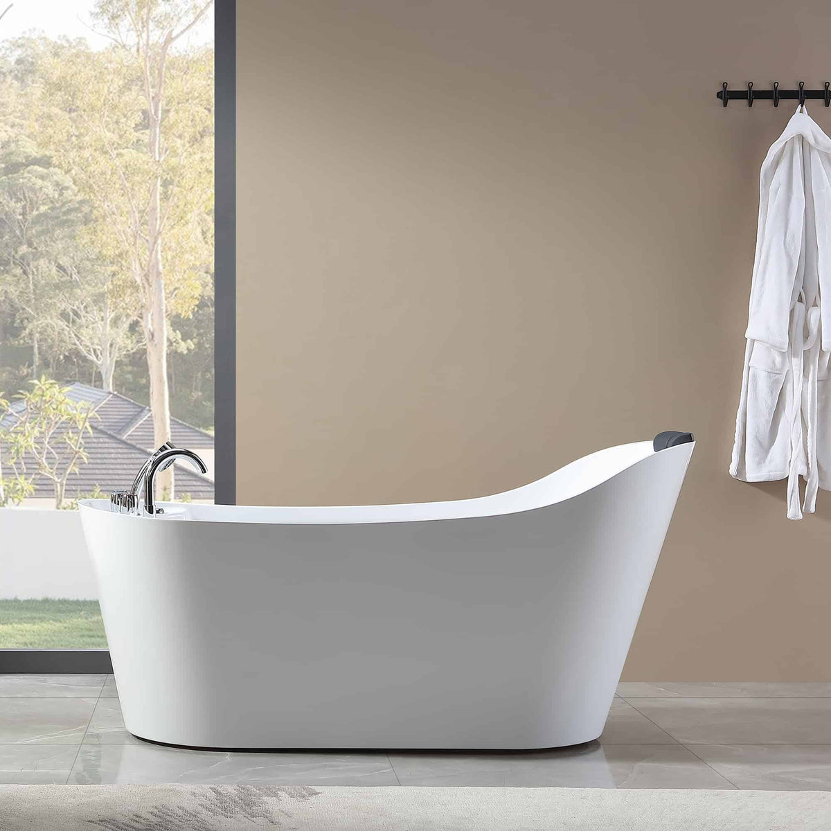 White freestanding acrylic bathtub with smooth curved rim and chrome faucet.
