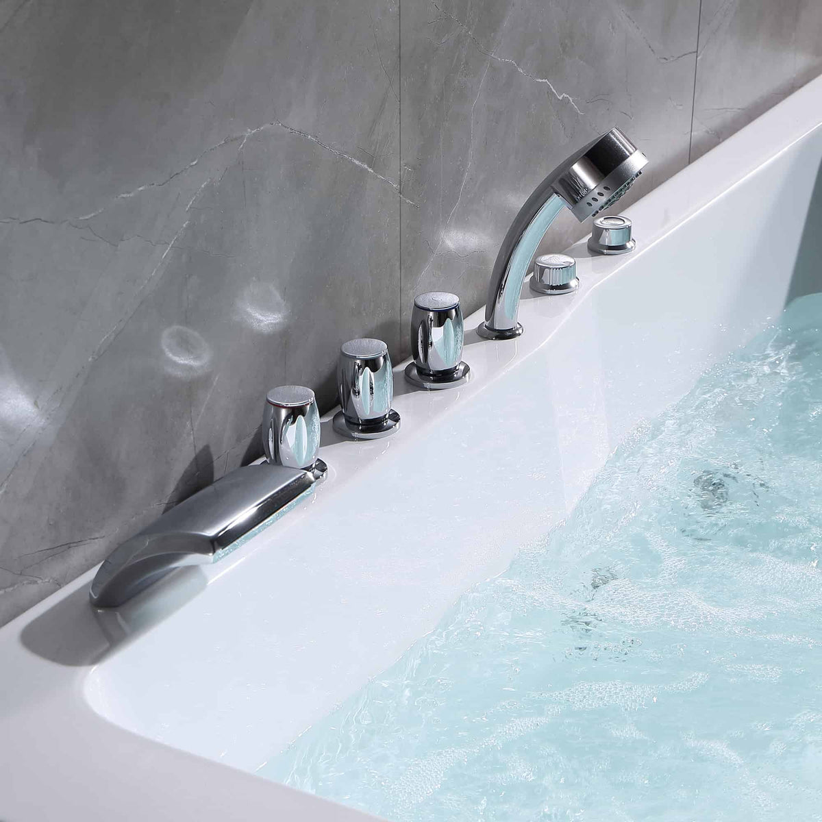 White bathtub wall-mounted chrome faucet and knobs above visible whirlpool jets