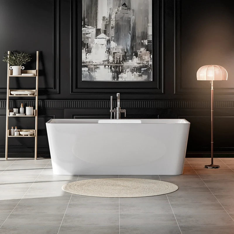 Freestanding soaking tub, glossy white, centered chrome faucet and rounded rectangular profile.