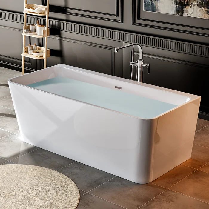 Freestanding soaking tub, glossy white with water-filled interior, angled side view.