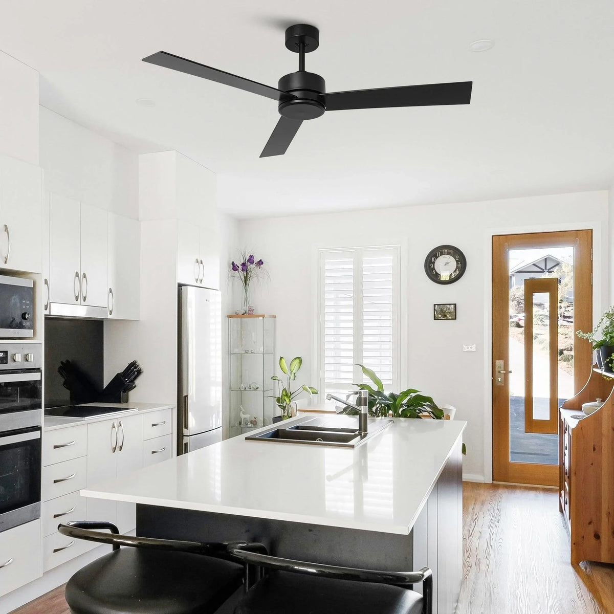 Black 3-blade ceiling fan in a modern kitchen