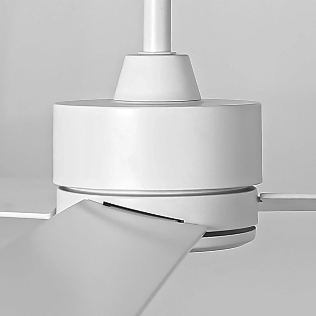 White ceiling fan motor housing with 3 blade arms and downrod connection