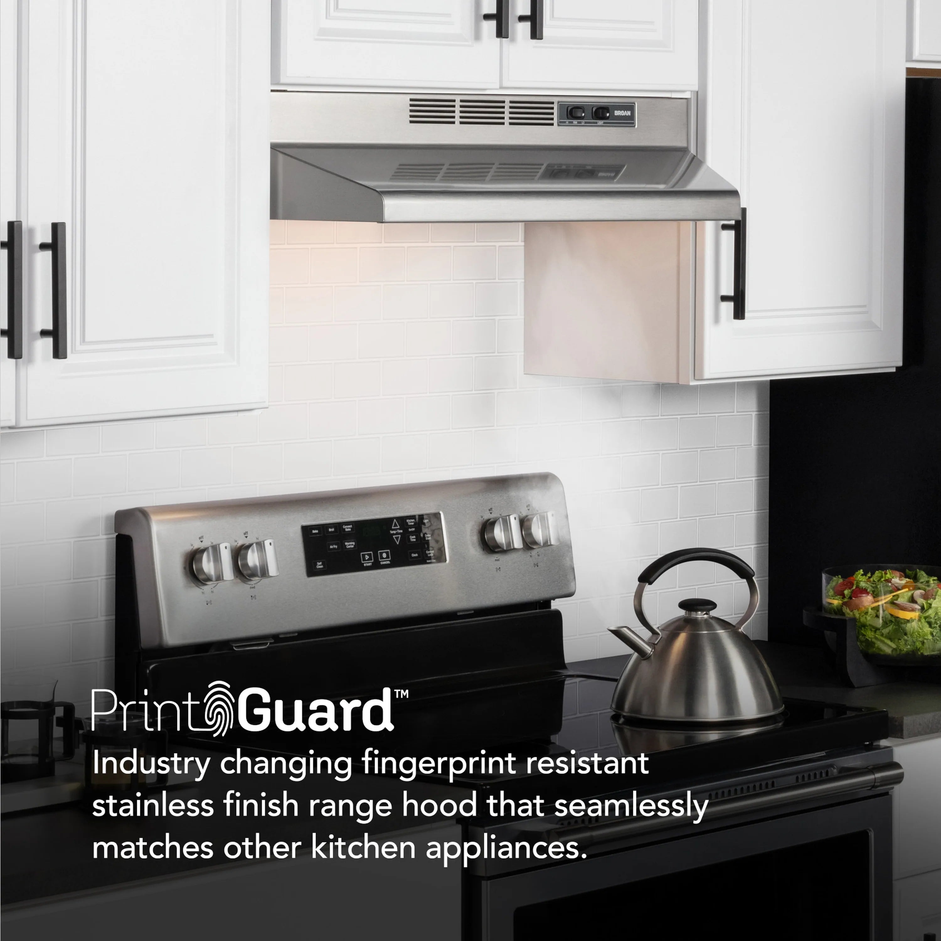 Stainless steel under-cabinet range hood installed above a stovetop control panel