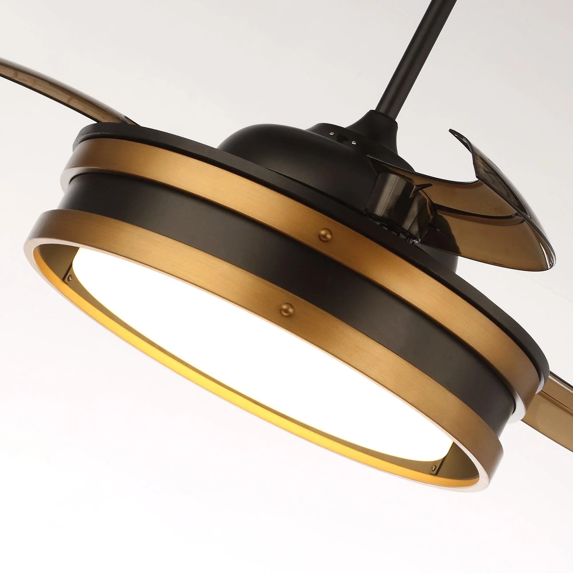 Angled view of black ceiling fan with LED light ring and bronze blades.