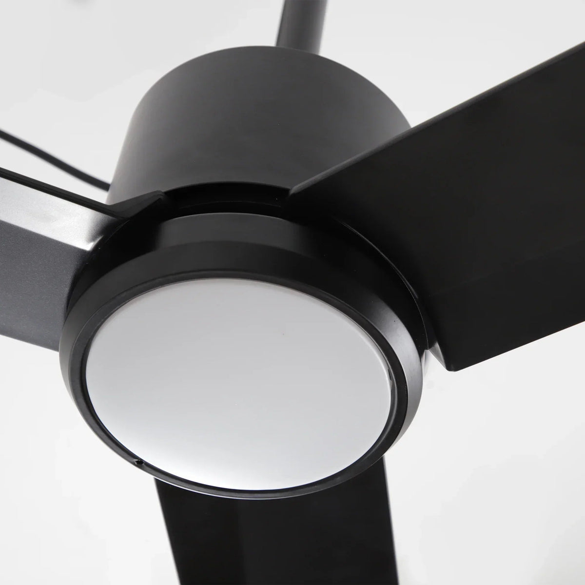 Black ceiling fan hub with circular LED light trim and three angled blades