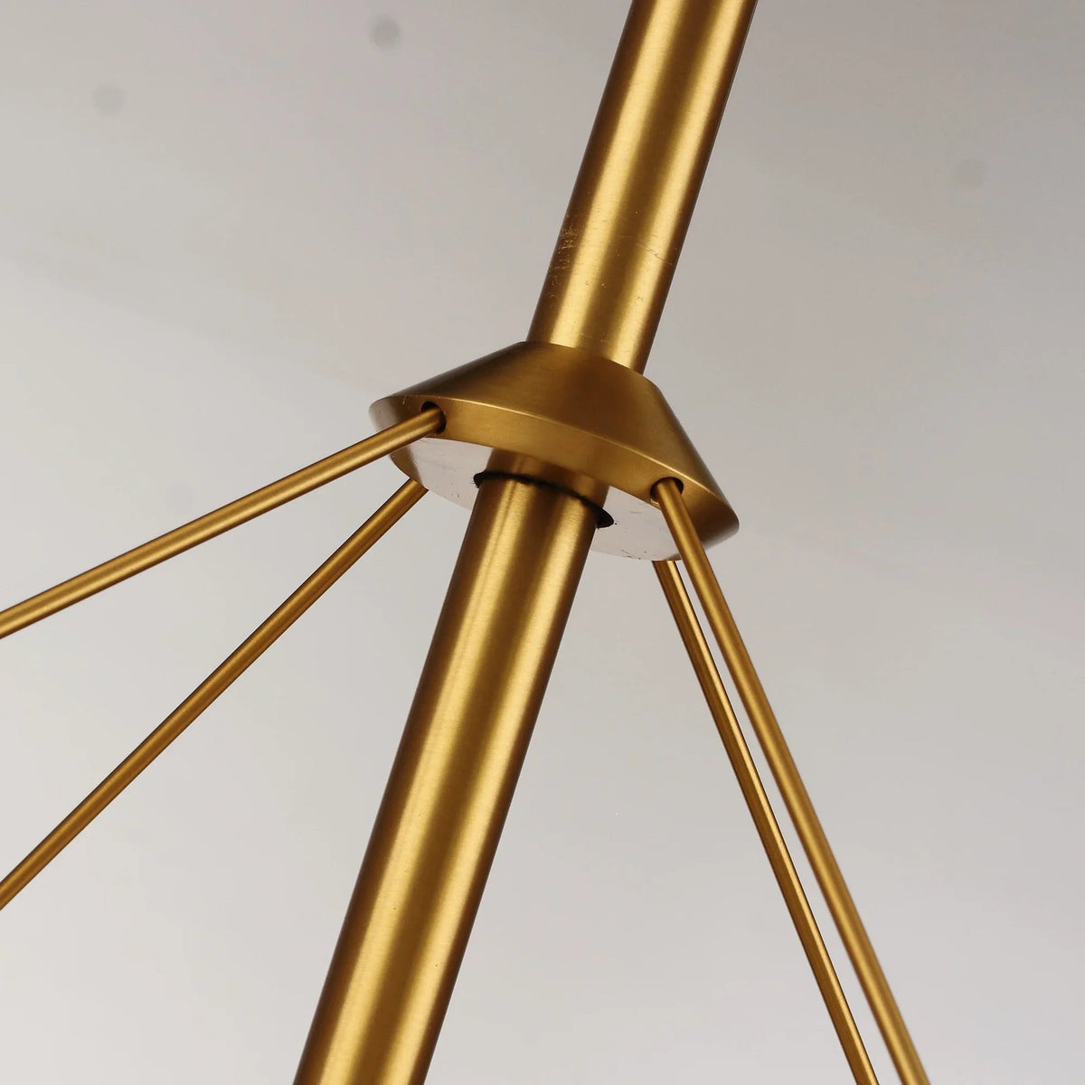 Gold ceiling fan downrod with mounting bracket and three angled support wires.