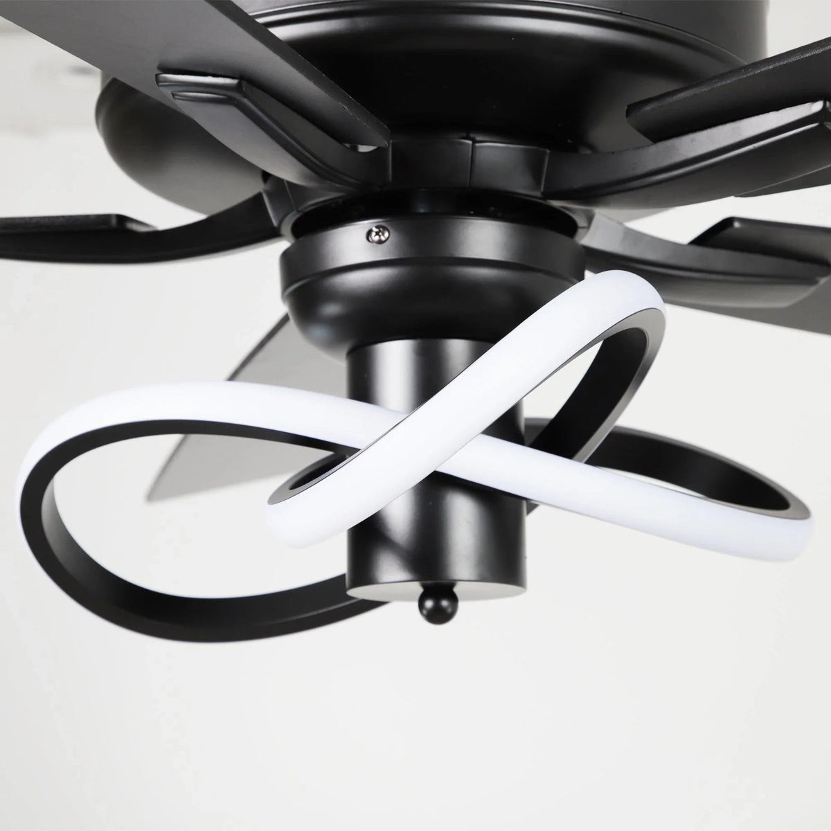 Ceiling fan with matte black housing and dark blades, LED light fixture rings