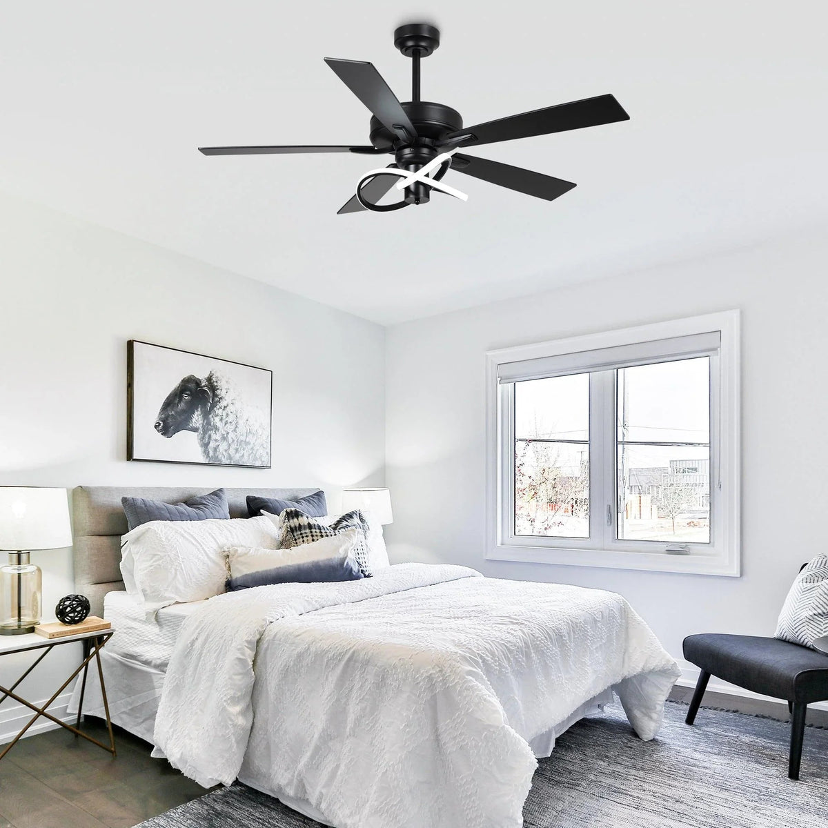 Black ceiling fan with wood-look blades and LED light ring on ceiling mount