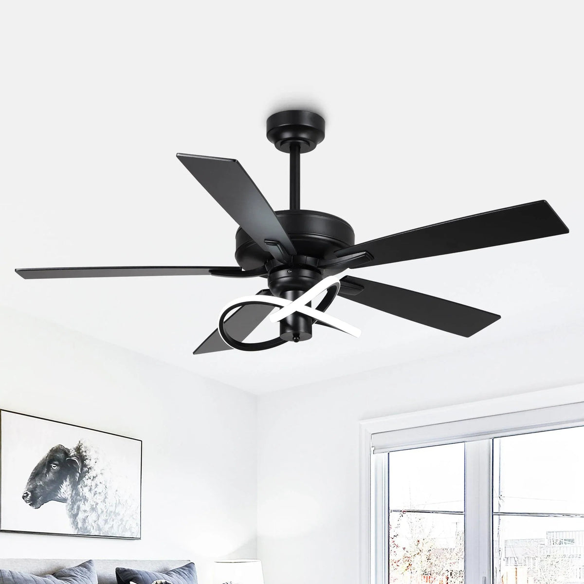 Black ceiling fan with wood-look blades and LED light ring, angled overhead view