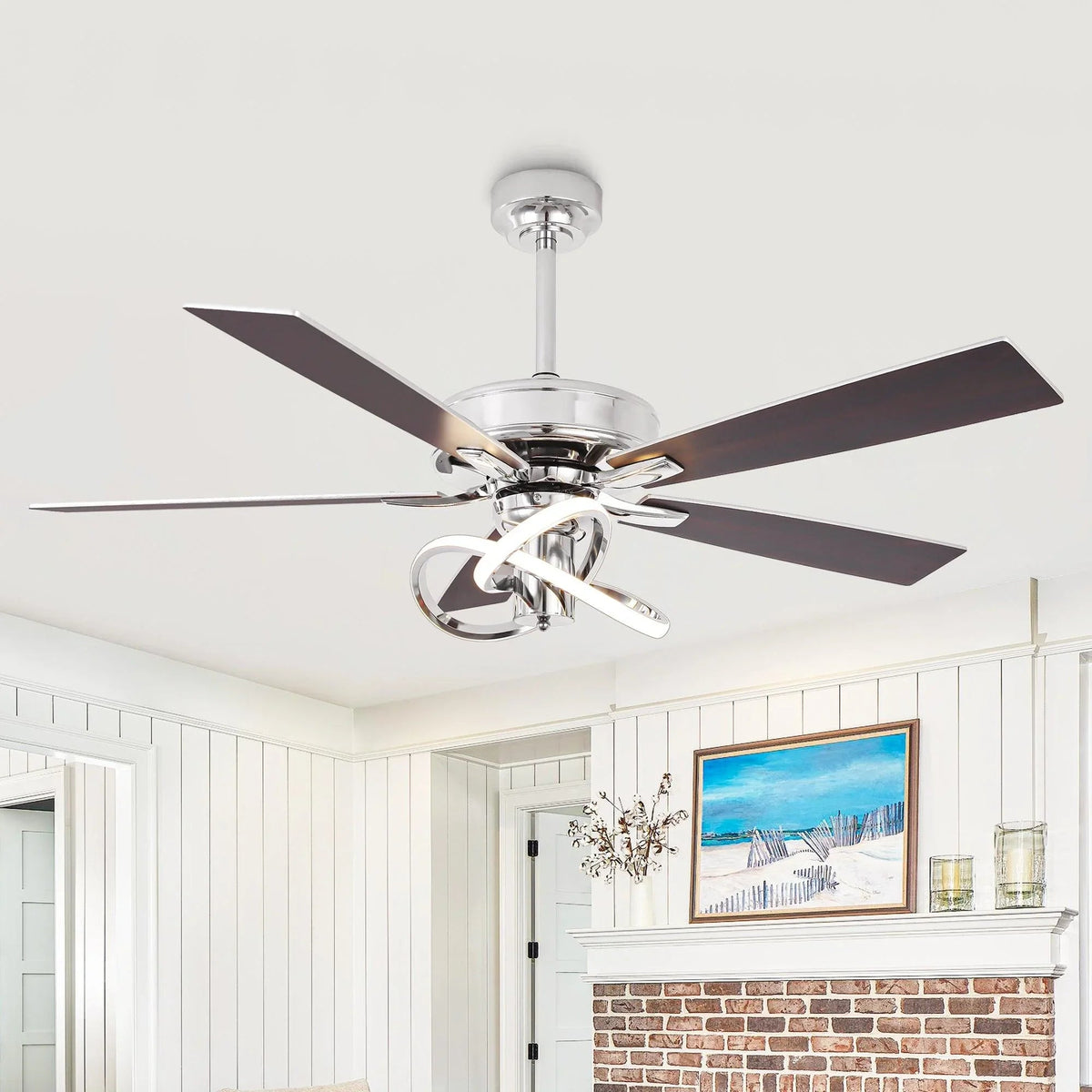 Chrome ceiling fan with five blades and LED light fixture at ceiling