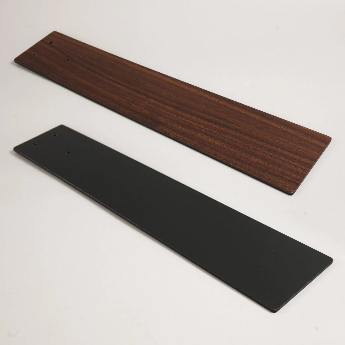 Ceiling fan blade brackets: one dark wood panel and one black panel