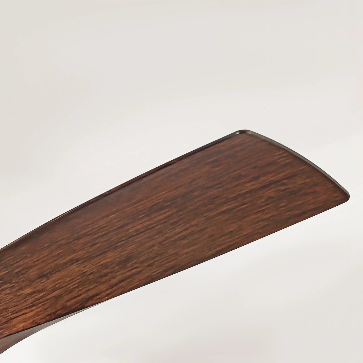 Brown ceiling fan blade with dark wood grain finish