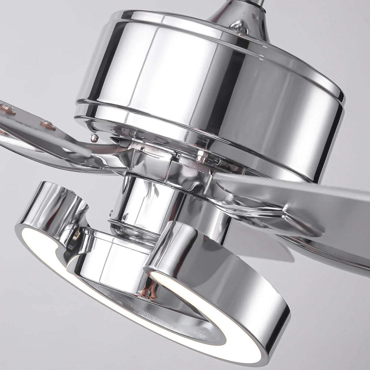 Chrome LED ceiling fan with dual ring light housings, close-up